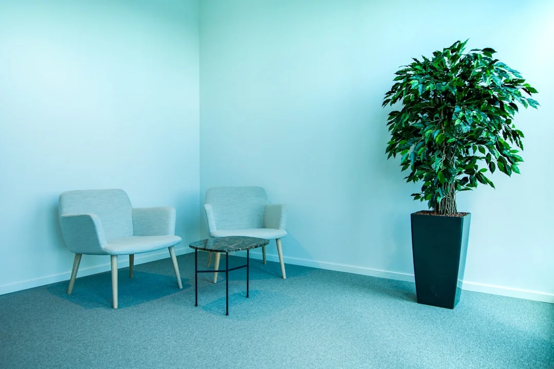A person sanitizes a workspace with fumigation while wearing full protective equipment for protection.